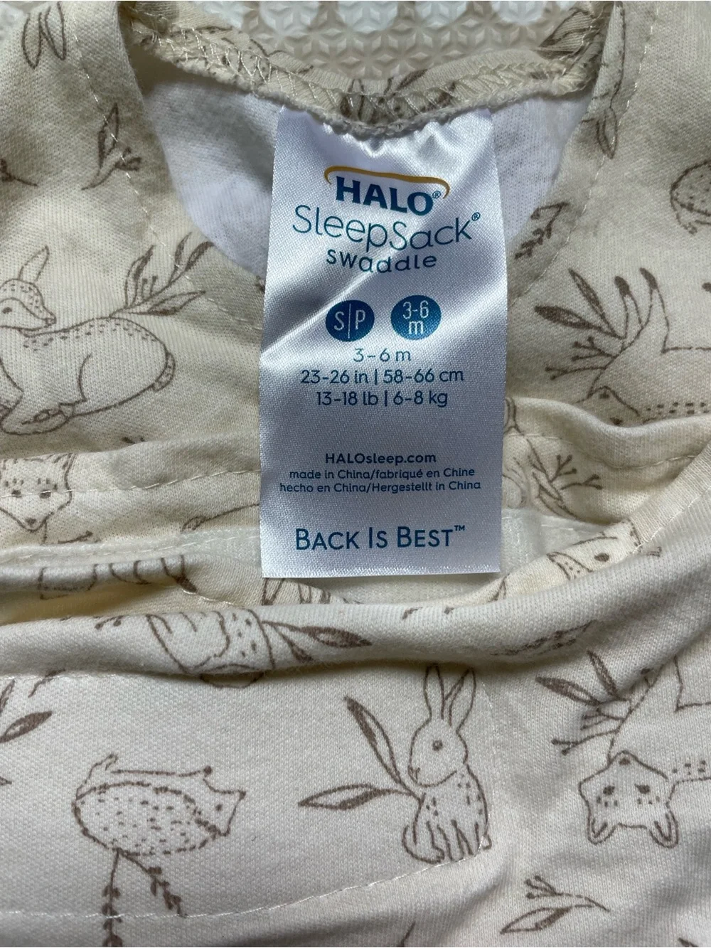 Halo SleepSack Swaddle in Cream with Brown Animal Print